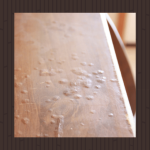 wood table damaged from moisture, transformer furniture inc. logo